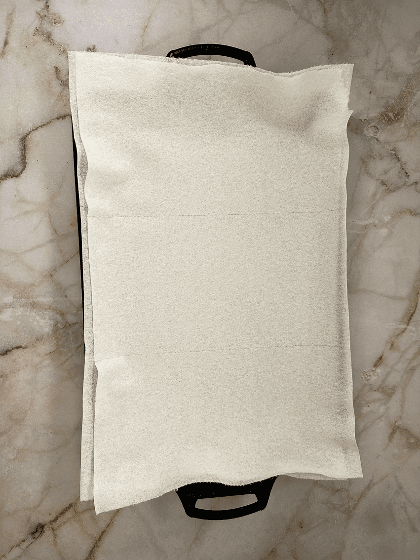 Paper towels on a baking sheet.