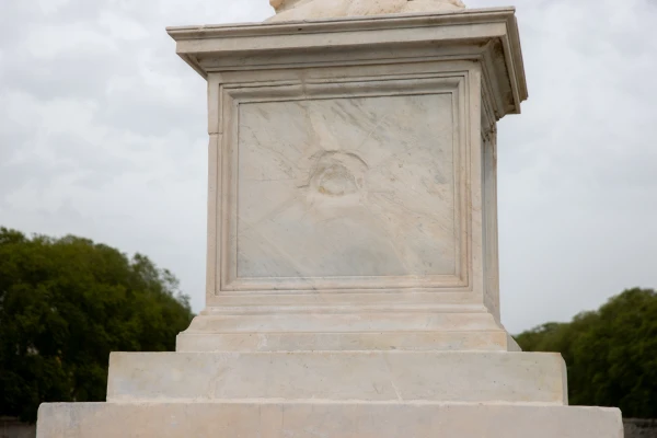 A visible cannonball dent marks the pedestal of an angel statue on Ponte Sant'Angelo, a battle scar from the defense of the Vatican in 1870. Credit: Daniel Ibáñez/CNA