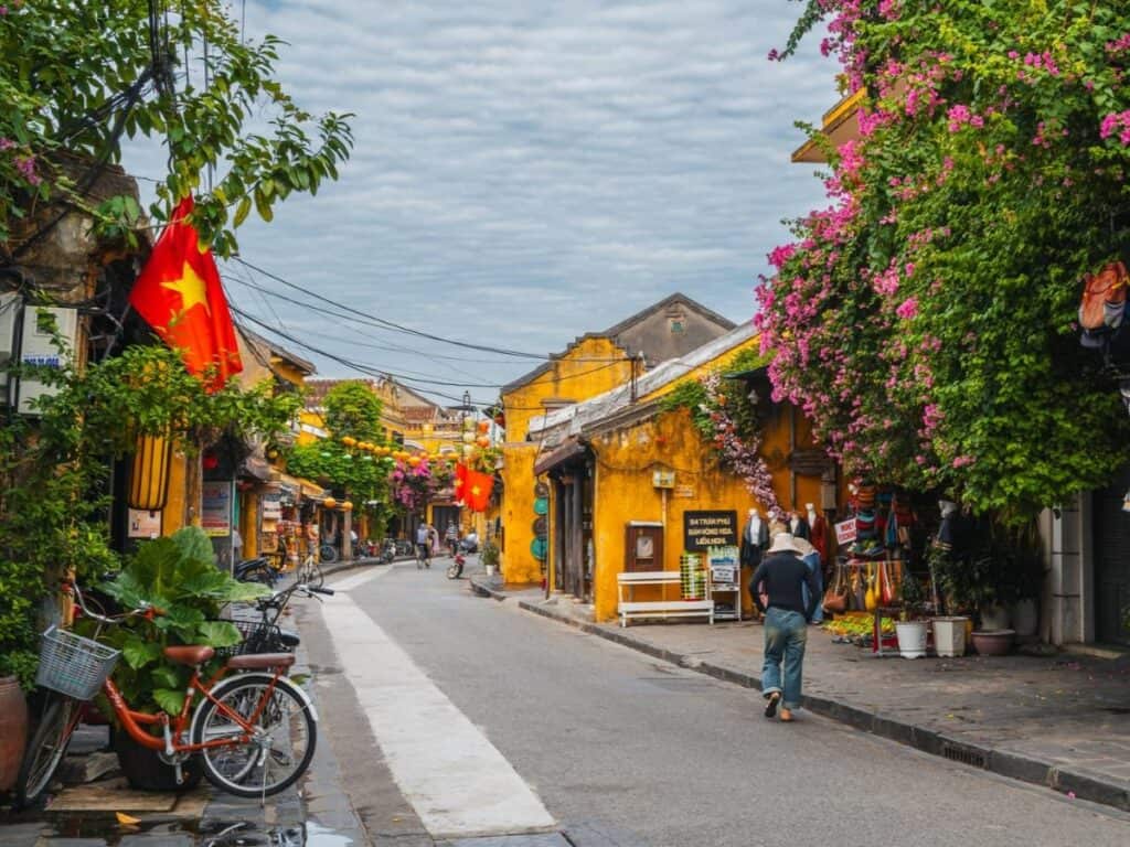 person walking along streets of hoi an