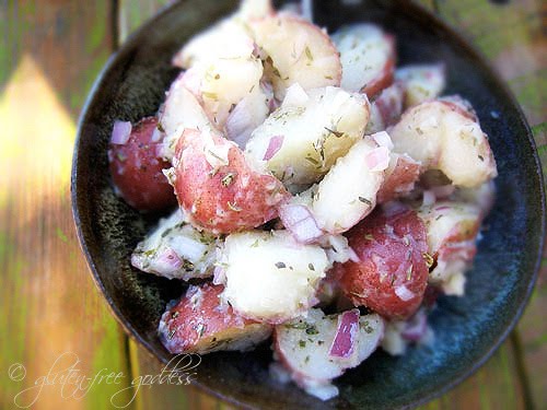 A bowl of vegan potato salad made with champagne vinegar and tarragon