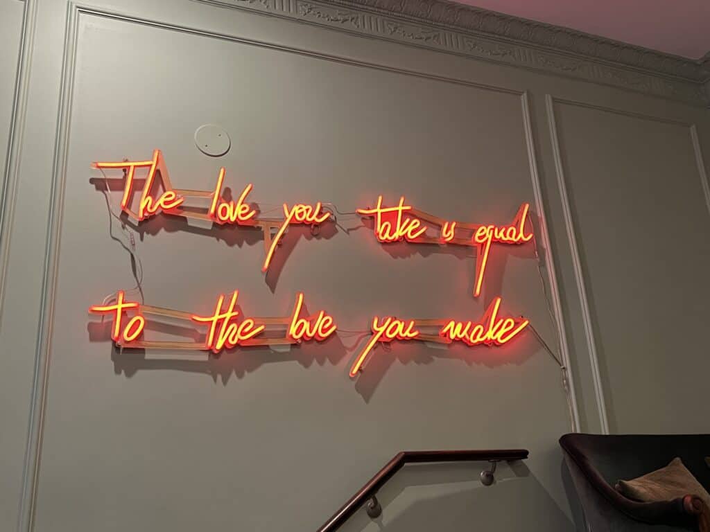 Charming British Hotel in San Francisco: My Stay at White Swan Inn 13 Wall in the lobby featuring a Beatles quote: “And in the end, the love you take is equal to the love you make.”