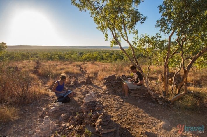 people on top of mountain on laptops