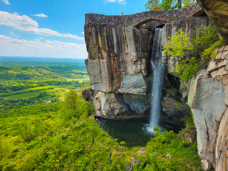 Lovers Leap Falls cascading over the cliffs and green valley in chattanooga