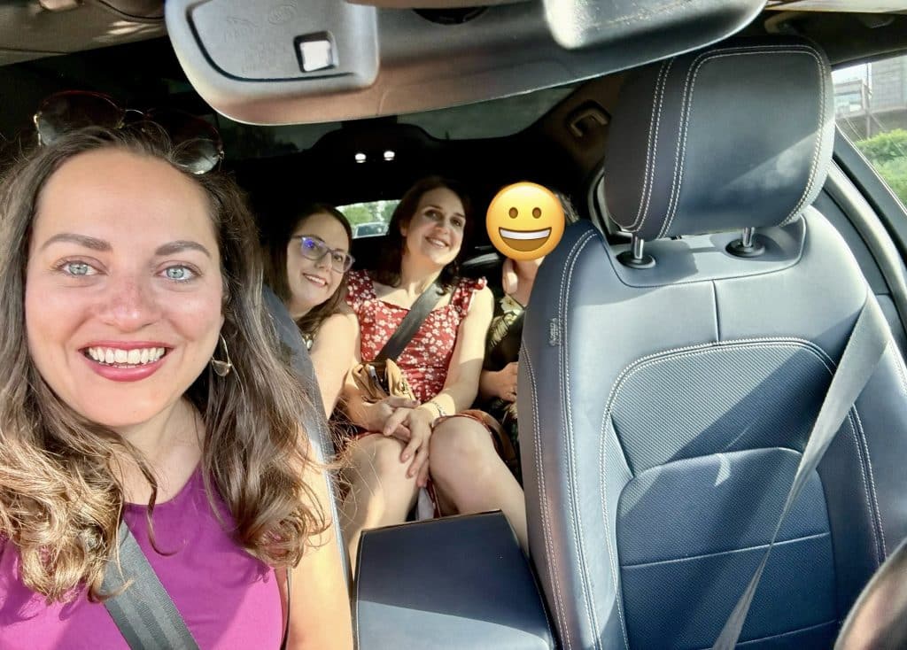 A selfie of Kate and her three friends in a car -- though nobody is in the driver's seat!