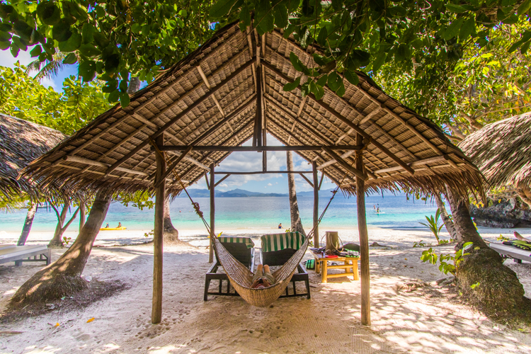 Family Adventure Vacations - Palawan - Relaxing on Entalula Island between kayaking and paddle boarding