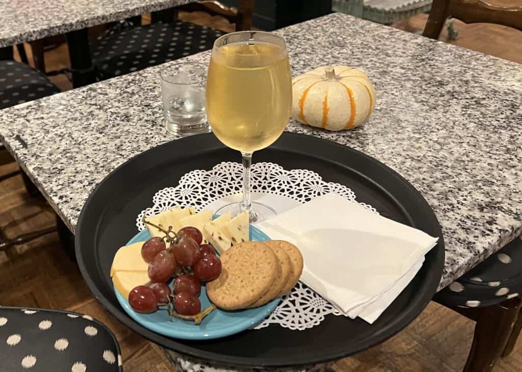 Charming British Hotel in San Francisco: My Stay at White Swan Inn 11 Large glass of white wine with a plate of cheese and crackers during the evening social hour at White Swan Inn.