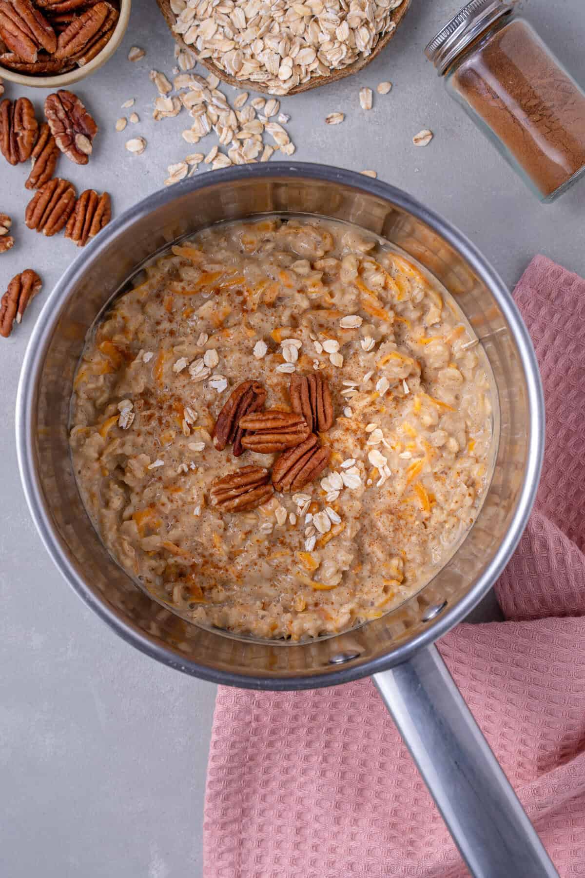 A saucepan full of carrot cake oatmeal.