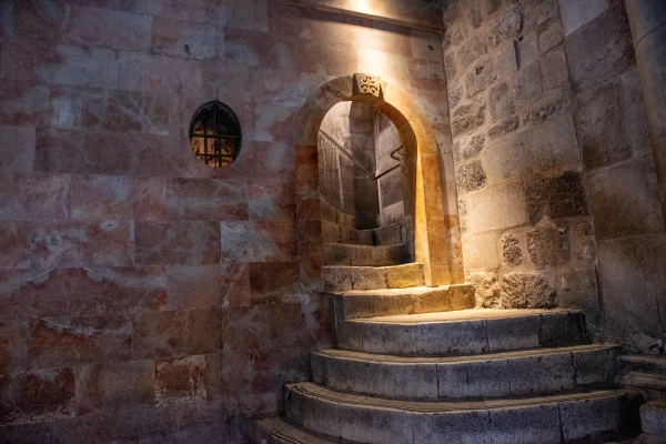 The staircase leading to Calvary in the Basilica of the Holy Sepulcher in Jerusalem. Calvary — the rocky spur now enclosed within the basilica — was incorporated into the Holy Sepulcher during the Crusader period. It is accessed by a staircase to the right of the entrance. Credit: Marinella Bandini