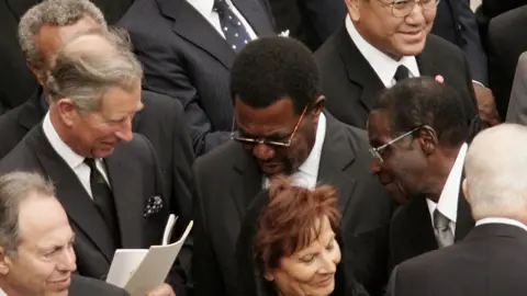 Getty Images The then Prince of Wales and Zimbabwe's Robert Mugabe at John Paul II's funeral in 2005