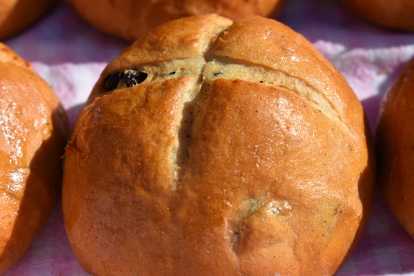 Oral and written historical accounts suggest Brother Thomas Rodcliffe first baked and distributed the special spiced buns to the poor on Good Friday in 1361 to mark the close of the liturgical season of Lent and the beginning of Easter. They were deliberately baked with the sign of the cross to associate it with Good Friday and Jesus’ death. Credit: Photo courtesy of St. Alban's Cathedral