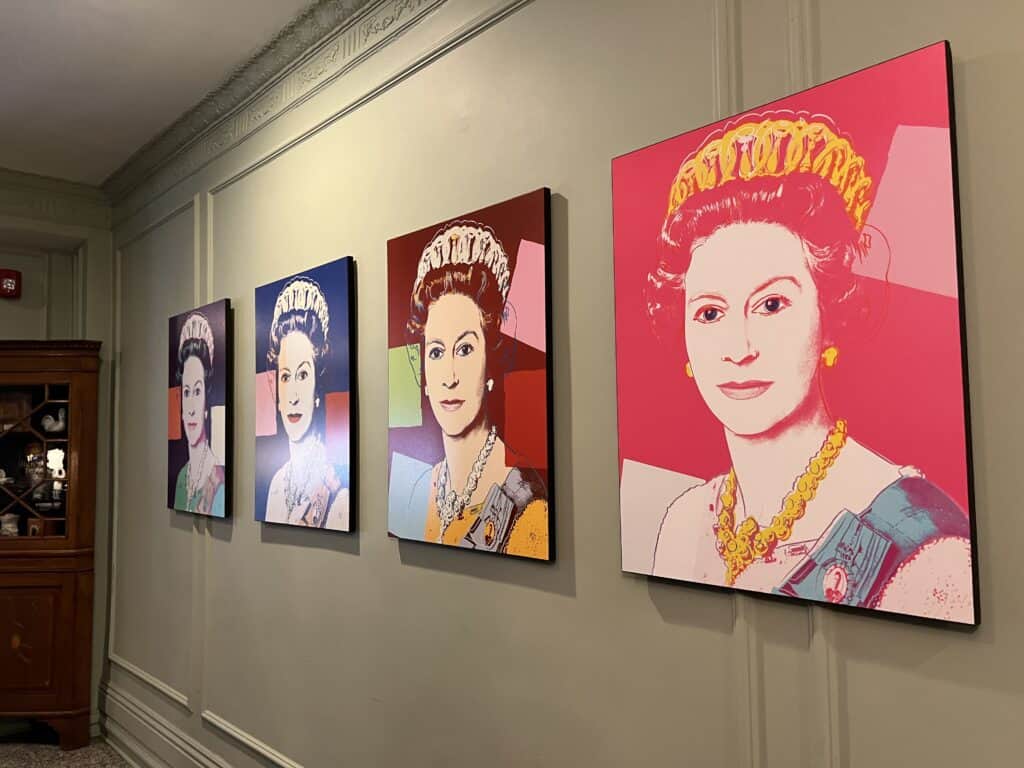 Charming British Hotel in San Francisco: My Stay at White Swan Inn 12 Whimsical paintings of Queen Elizabeth II in the hotel lobby, welcoming guests with flair.