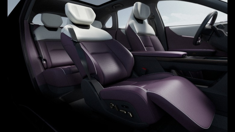 look back at the EZ-60s purple and white front seats that recline with a foot rest and have headrest speakers
