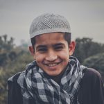 A young person smiling