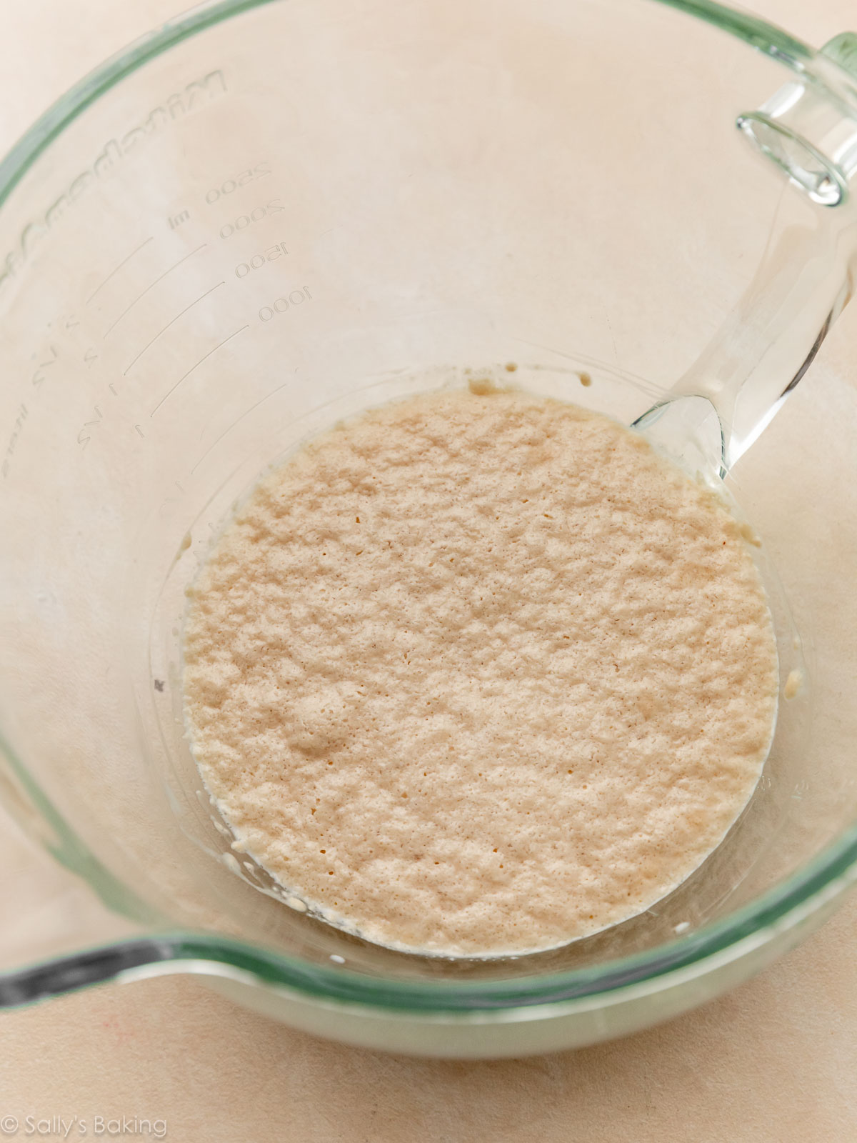 proofed yeast mixture in glass bowl.