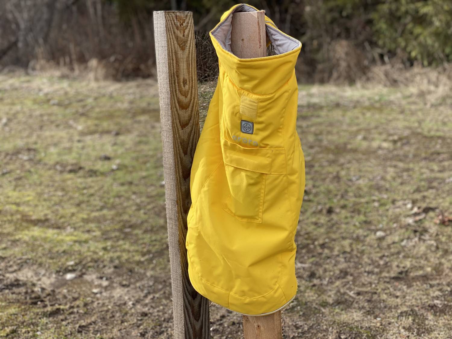 ororo Koldpwoof Heated Dog Vest Review - vest on a piece of wood