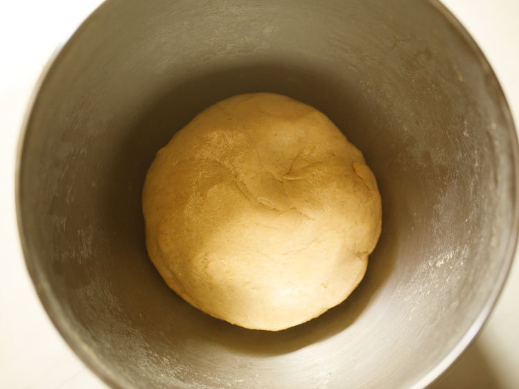 dough brushed with some water and kept in the same bowl. 