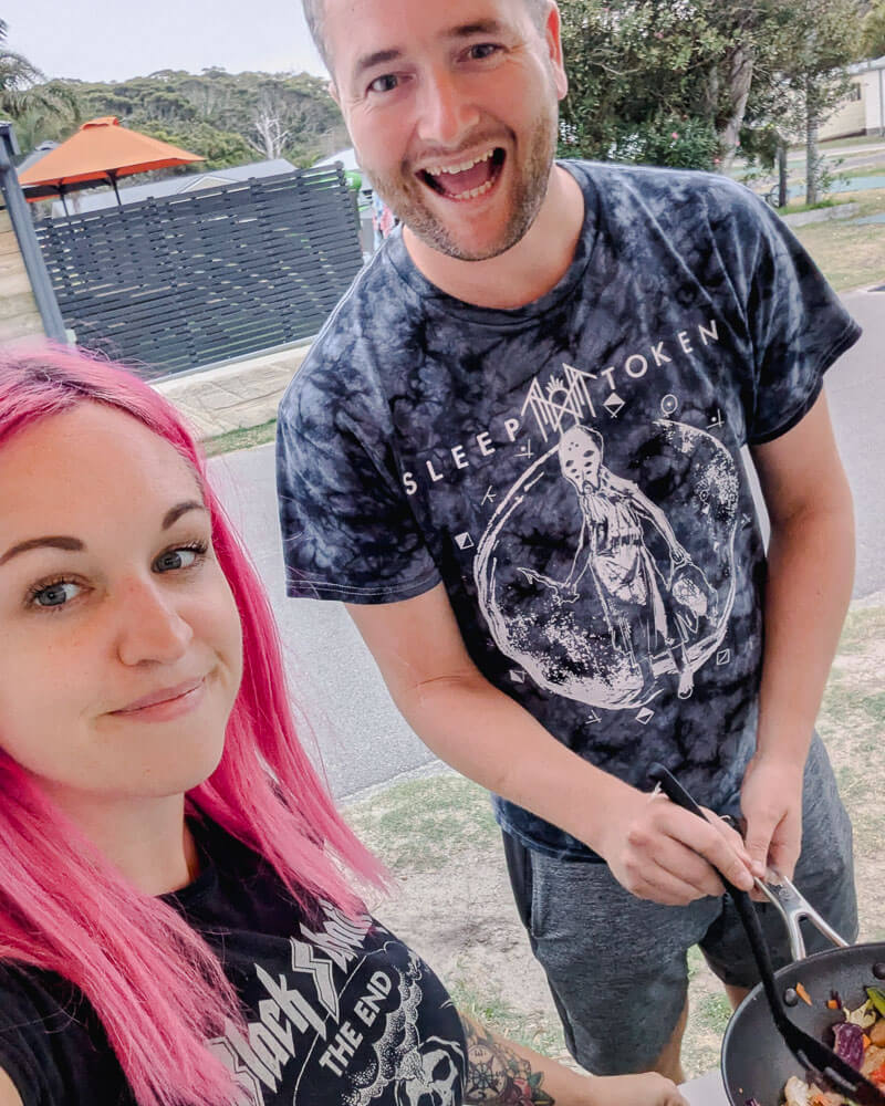 Milly and Ashley cooking a stir fry together on a camp stove