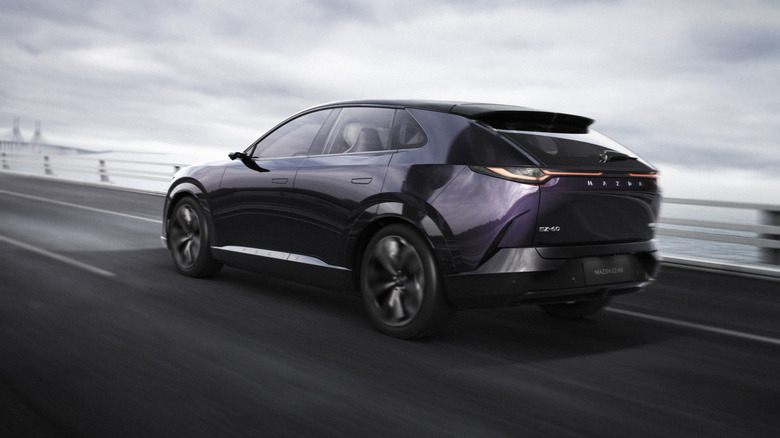 ﻿﻿rear three quarters shot of a purple EZ-60 driving on a bridge