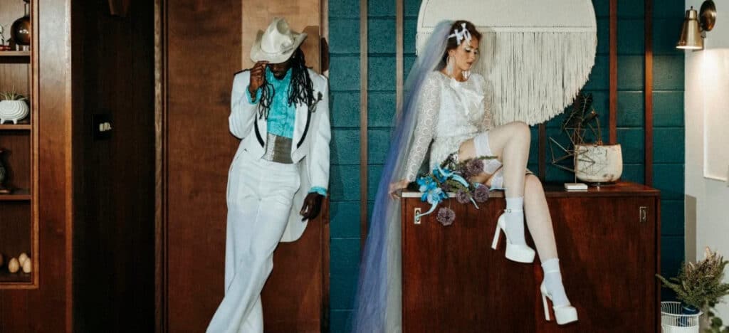 Stylish bride and groom posing artistically