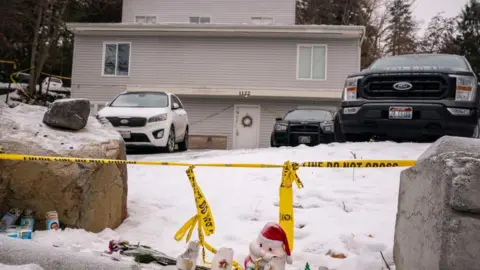 Getty Images A house where four students were murdered is cordoned off