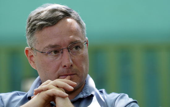 Former Army officer Eugene Vindman, a Democrat who running for Congress in Virginia's 7th District, is interviewed at a coffee Thursday, Sept. 12, 2024, in Stafford, Va. (AP Photo/Jay Paul)