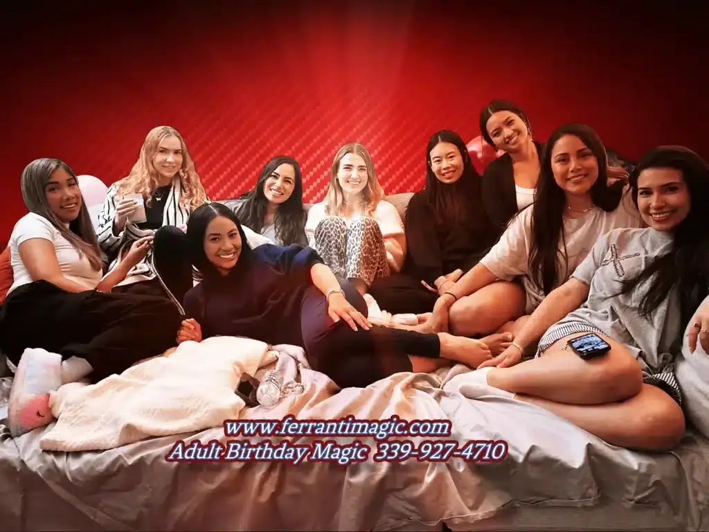 Birthday magician Joe Ferranti entertains a group of young women celebrating a special day