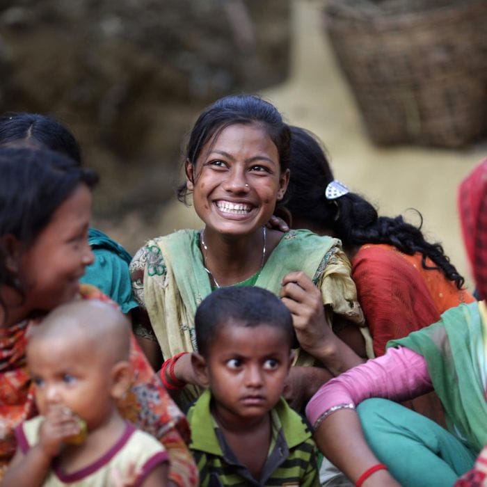 smiling mother with small children