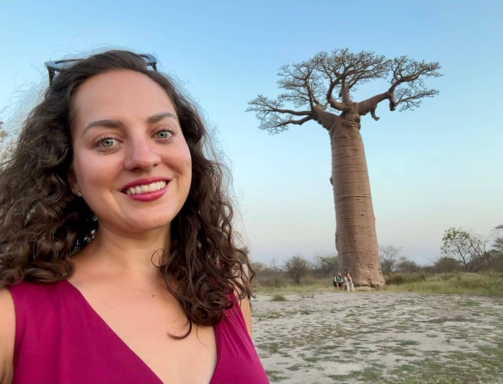 Kate taking a selfie with a big baobab tree in the background.