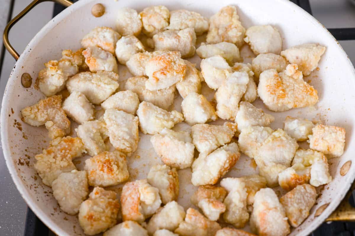 Browning chicken in a skillet. 