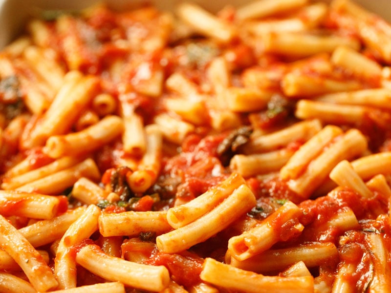 second layer of ziti and tomato sauce in casserole