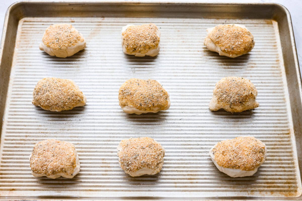 Chicken pillows on the baking sheet ready to go in the oven. 