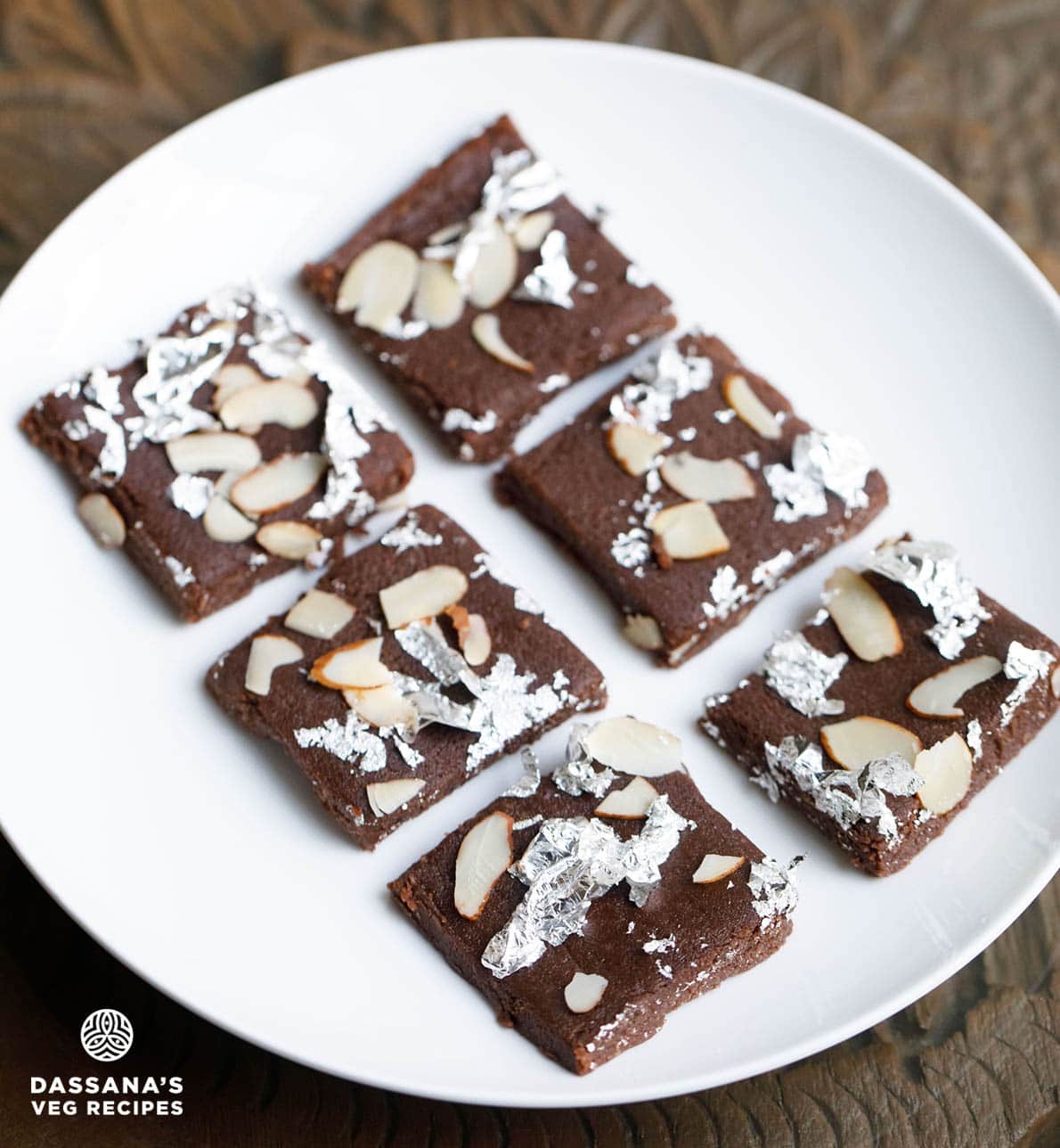 Chocolate barfi with almond toppings and silver varq.