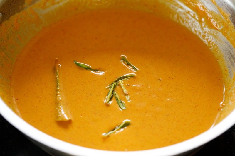 Slit chillies floating on top of the gravy.