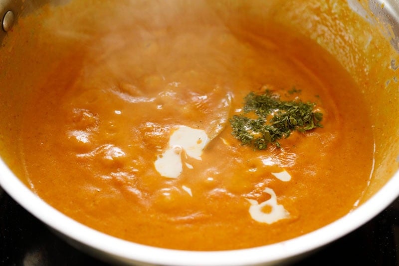 Cream and dried fenugreek leaves added to the gravy.