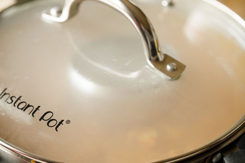 Glass lid kept on the pan.