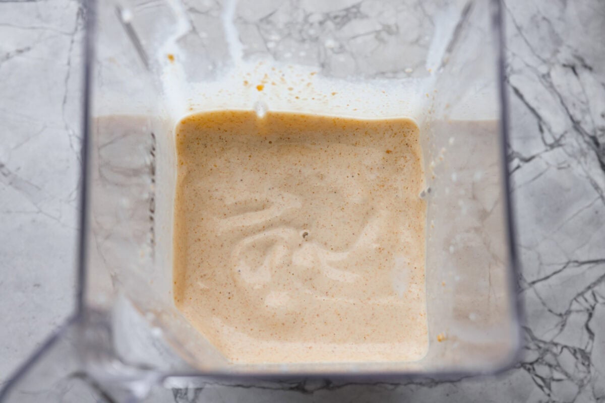 Pie milkshake ingredients blended up in a blender. 