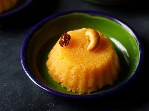 rava kesari in a small green plate.