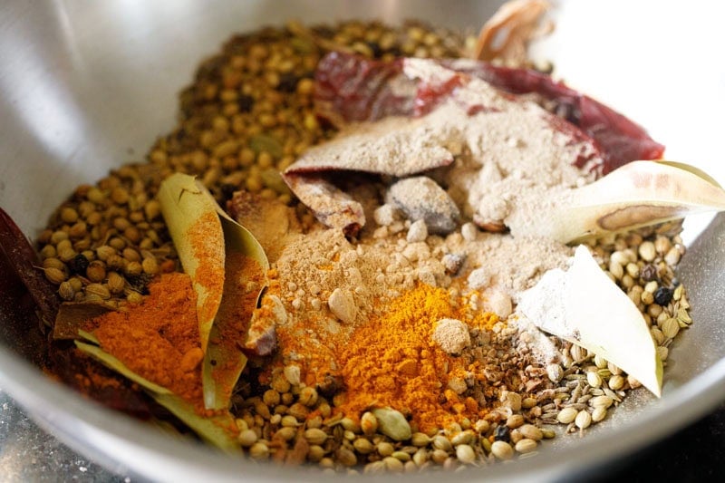 Ground spices in the same pan with roasted whole spices.