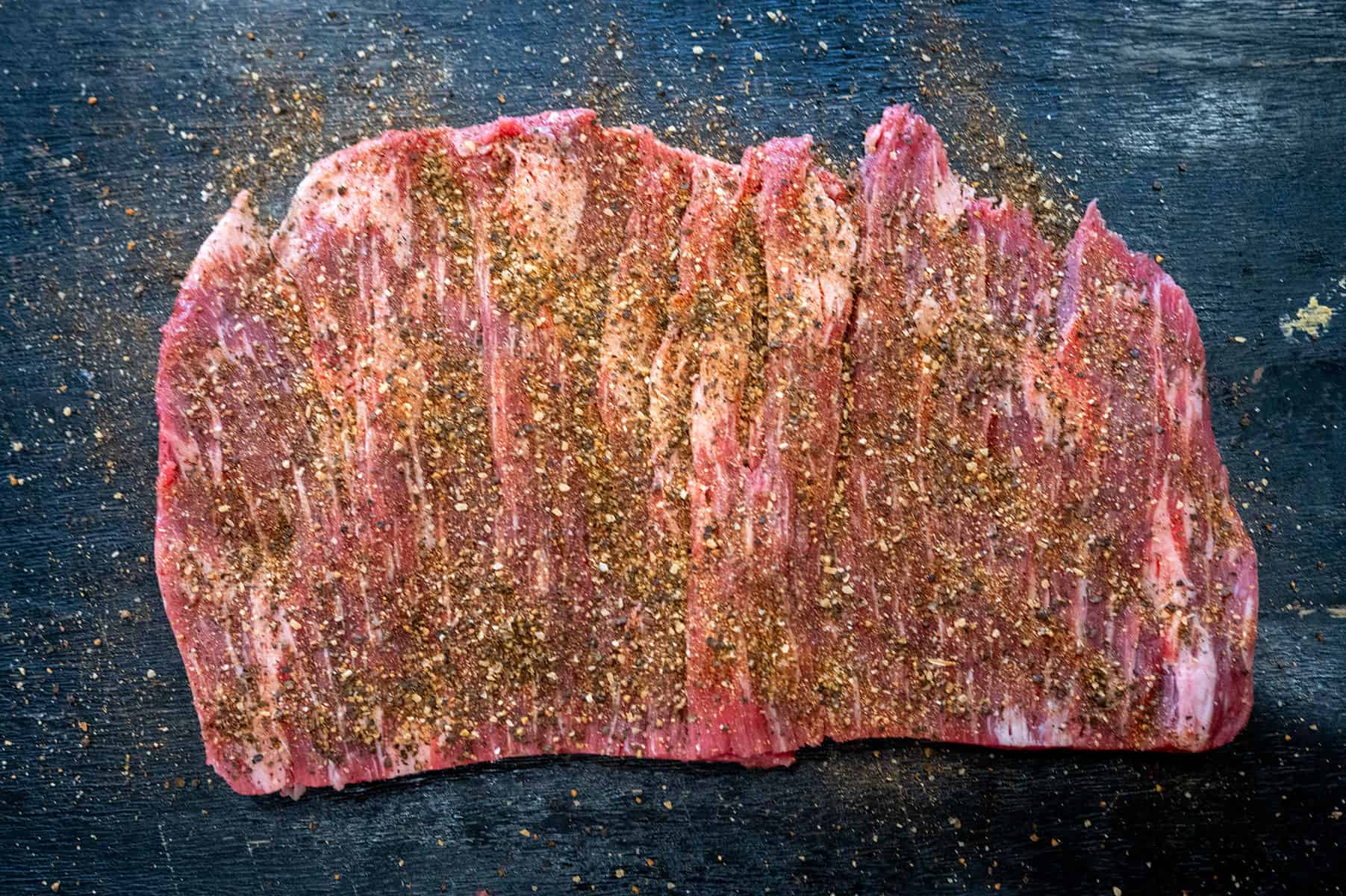 Butterflied flank steak seasoned with brisket rub.