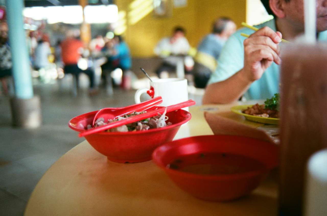 Hawker Centre Food Court in Singapore. Photo by Rich Teo on unsplash