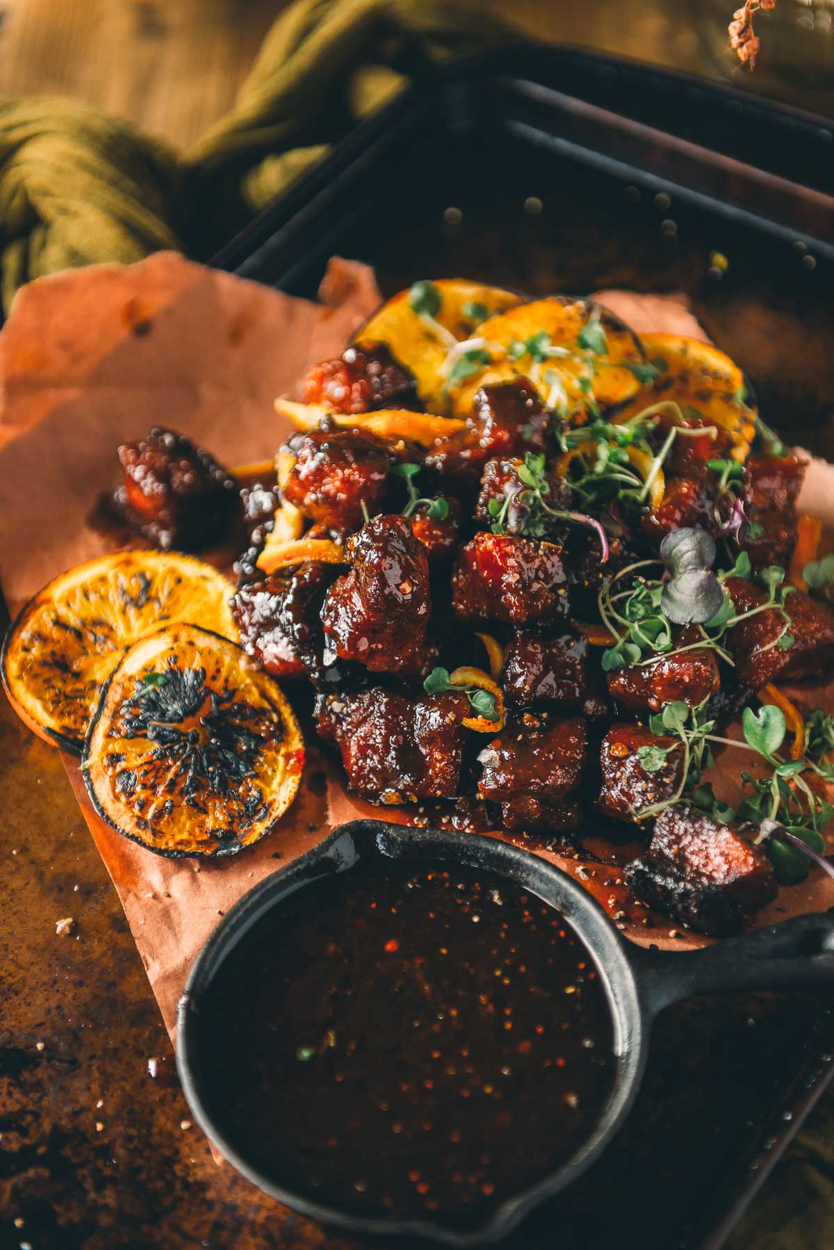 Smoked pork belly burnt ends served beautifully on a plate.