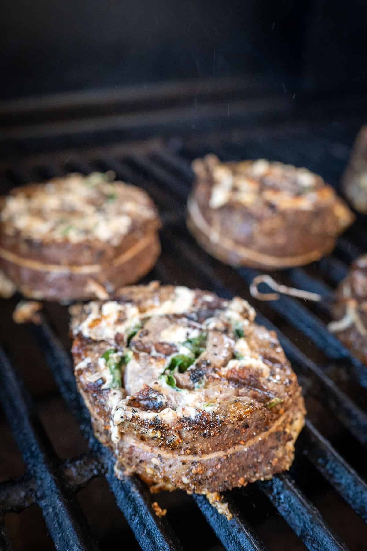 steak pinwheels on grill.