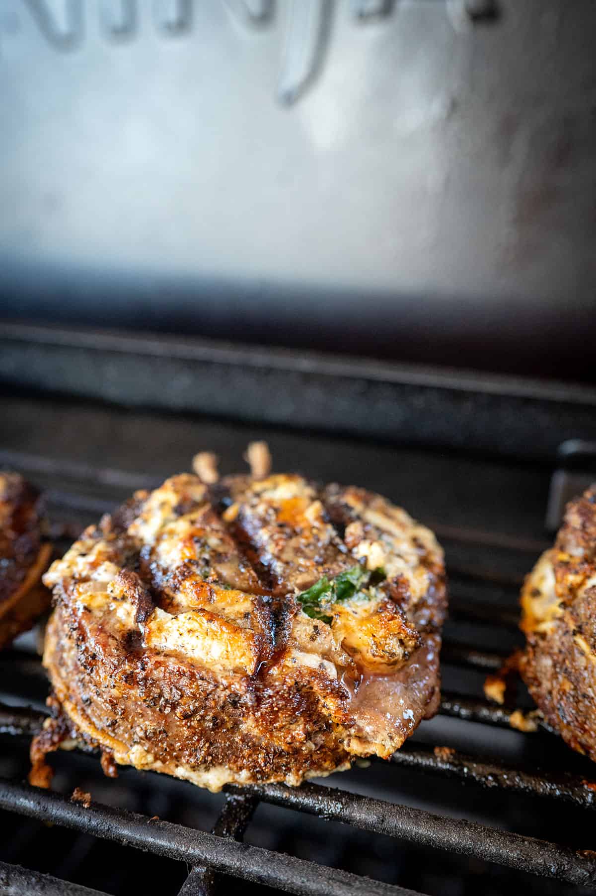 steak pinwheels on grill over indirect heat.