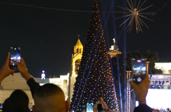 ‘Light of hope for us’: Christmas lights illuminate Bethlehem and Jerusalem for the first time in two years