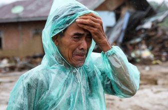 Indonesian man searches for missing wife after devastating floods