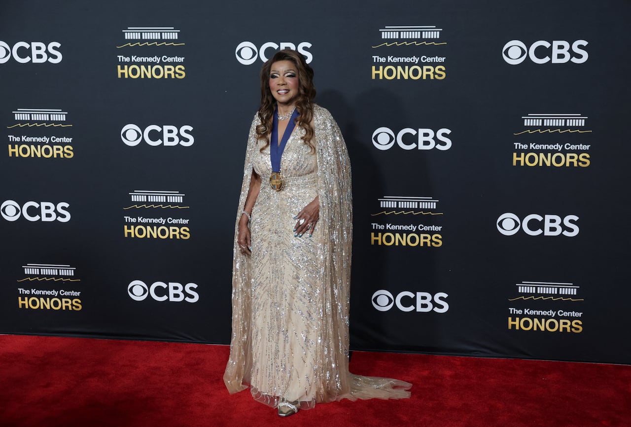 A woman poses on the red carpet