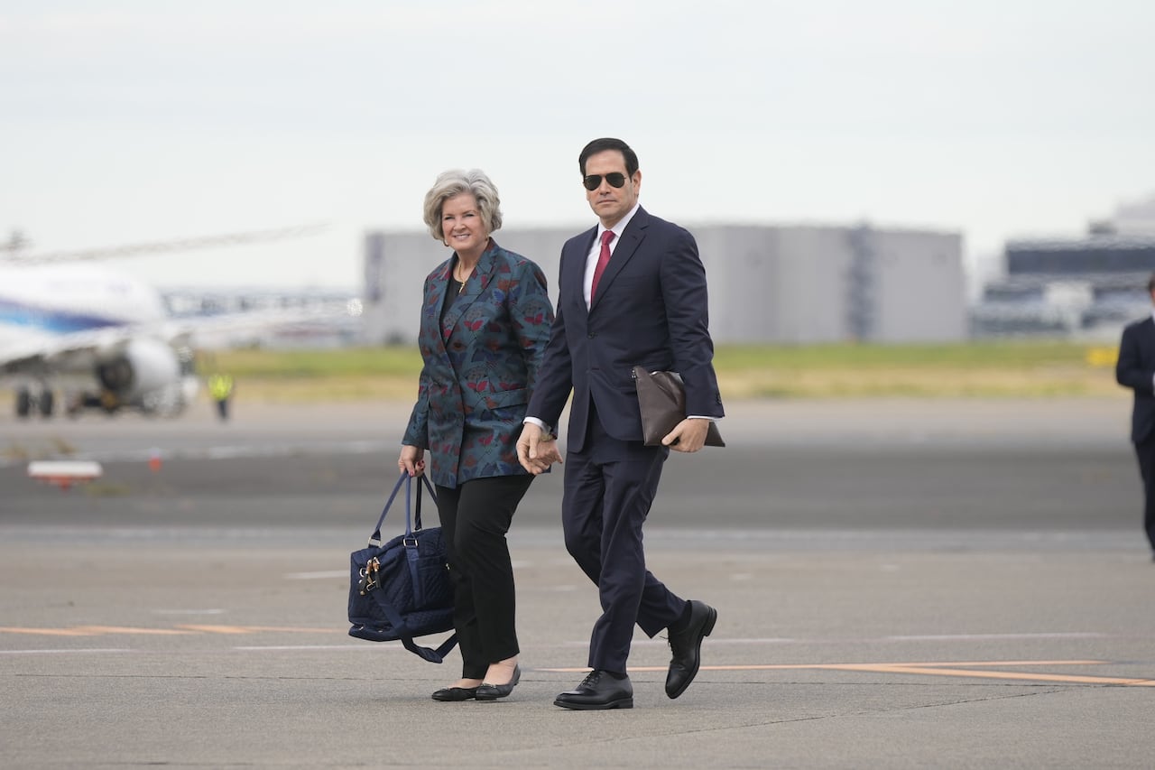 U.S. Secretary of State Marco Rubio, right, and White House chief of staff Susie Wiles prepare to leave Haneda Airport in Tokyo, Japan, Wednesday, Oct. 29, 2025.