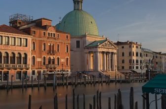 Woman waiting for the next boat. Venice, Italy
