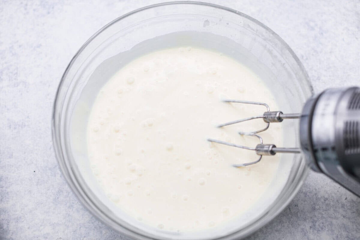 This Christmas ribbon salad brings all the festive vibes with its bright, sliceable layers. It looks fancy, but the process is super easy and mostly hands-off. Make it ahead and watch it disappear! Someone added the gelatin and the cream cheese mixture together with a hand mixture.