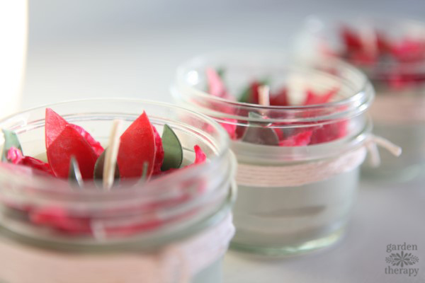 These poinsettia candles make for a fun handmade Christmas project. They are made with beeswax and soy wax and scented with festive essential oils.